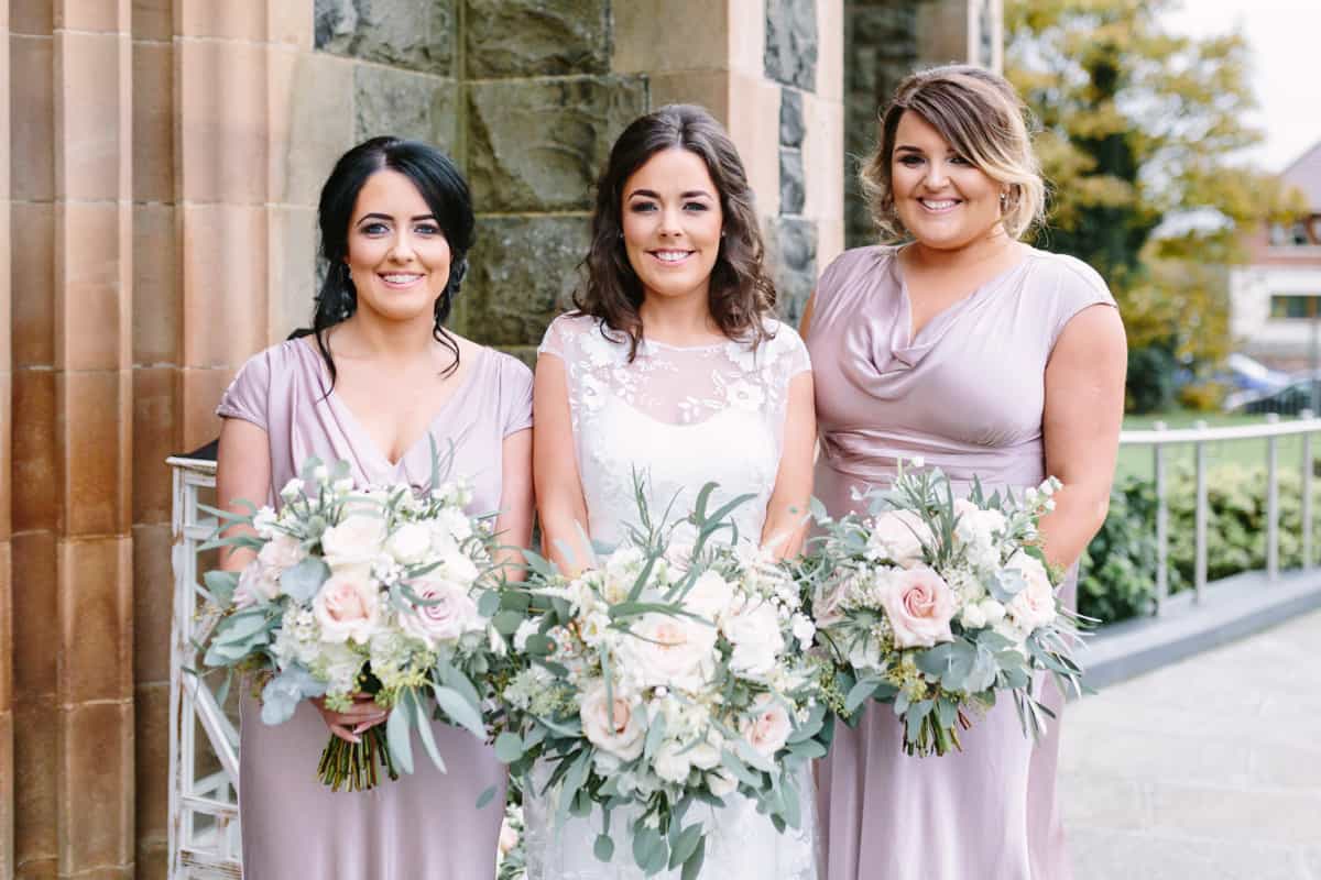 Bride and bridesmaids outside church