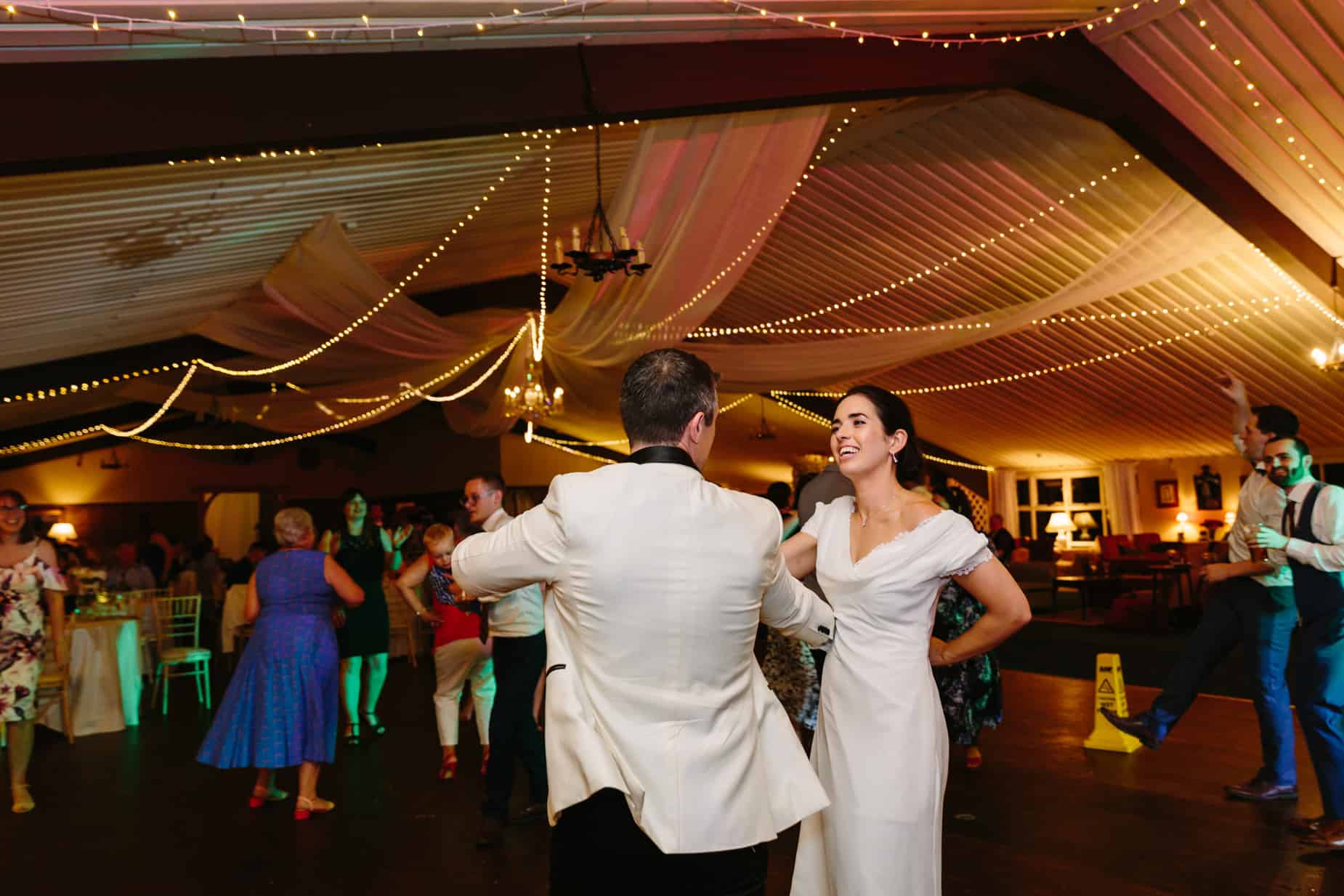 Bride and groom dancing on dance floor